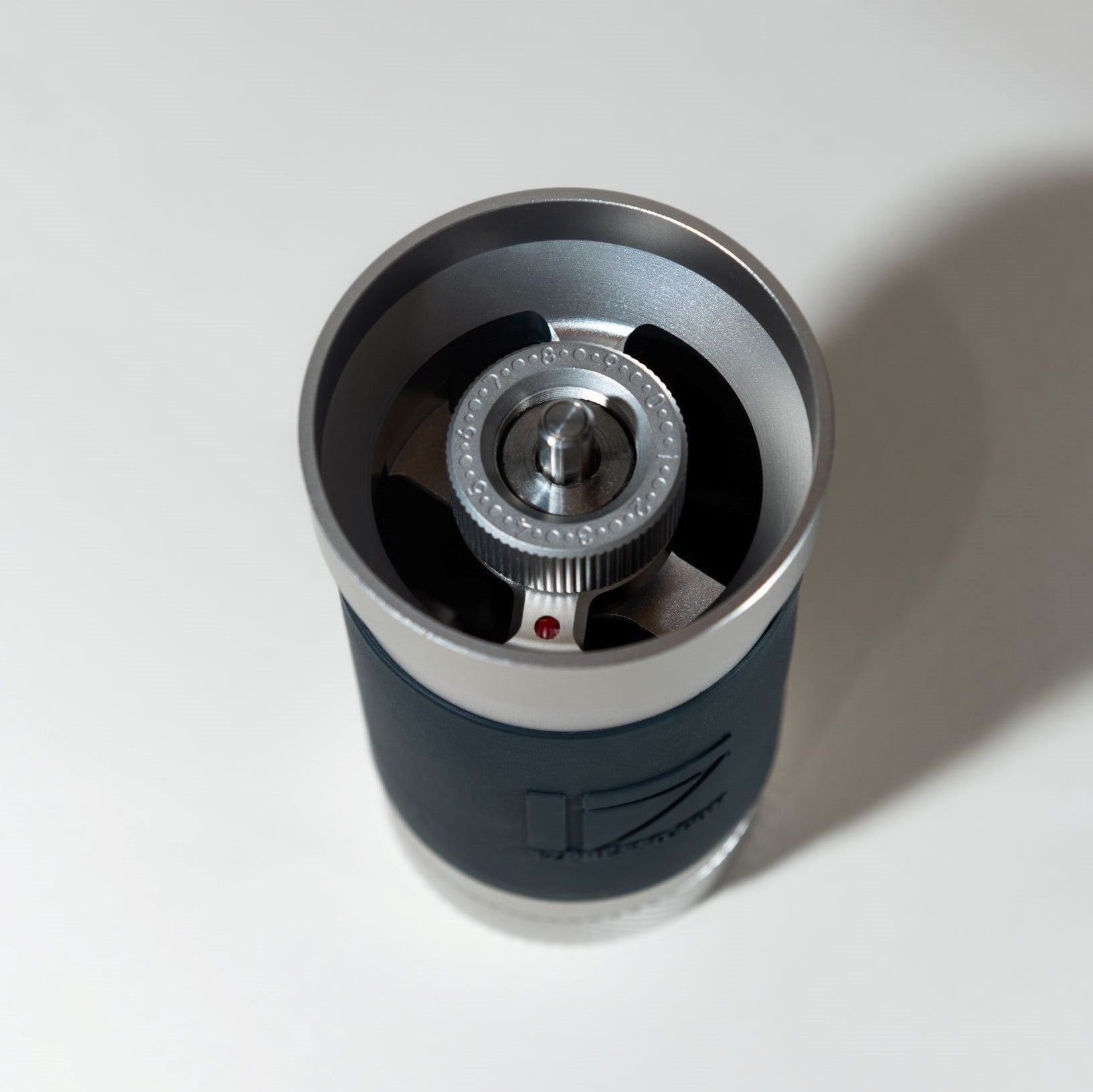 JX Pro hand grinder. Manual Grinder in silver. Viewing the top of the chamber where you insert coffee beans